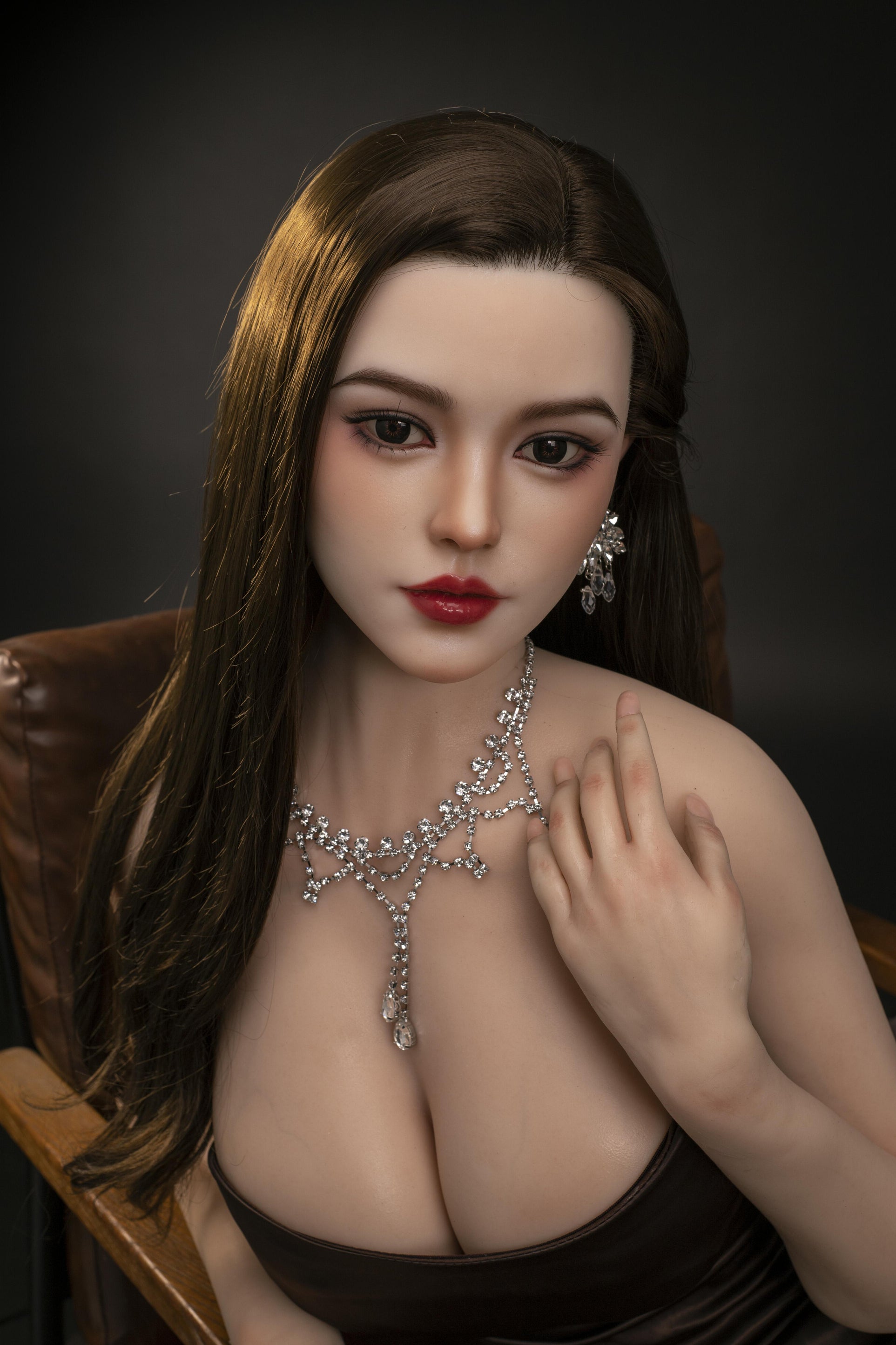 silicone sex doll in asian style on chair close up of face