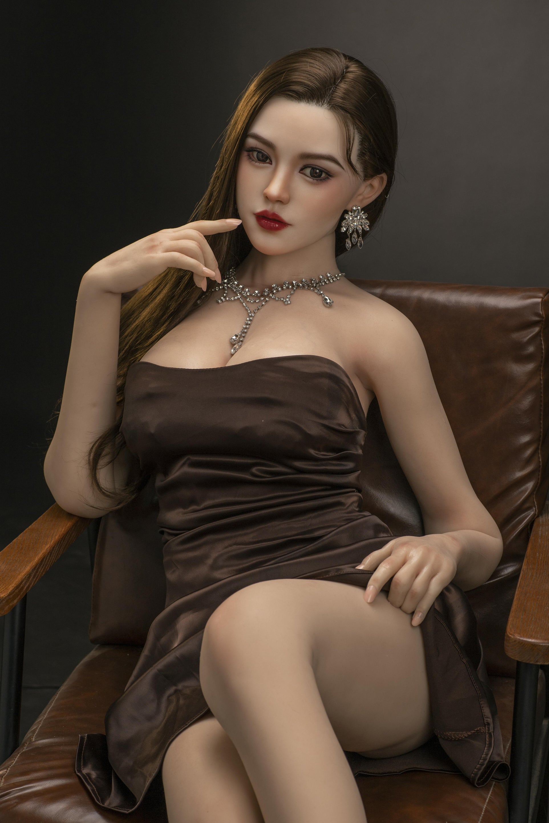 asian style sex doll on brown chair